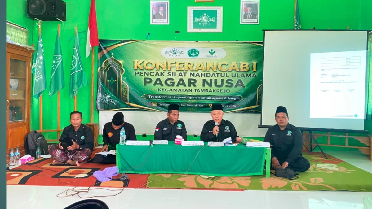 Sekretaris PW Pagar Nusa Jawa Timur KH Abdul Mujib SH MH menyampaikan sambutan pada Konferancab PAC Pagar Nusa Tambakrejo di Gedung MWCNU Tambakrejo, Minggu (2/8/2026).