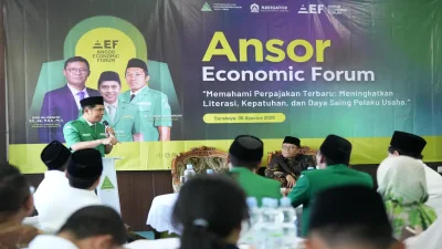 Ketua PW GP Ansor Jawa Timur Musaffa Safril menyampaikan sambutan pada Ansor Economic Forum 2026 di Surabaya tentang penguatan literasi perpajakan bersama DJP se-Jawa Timur.